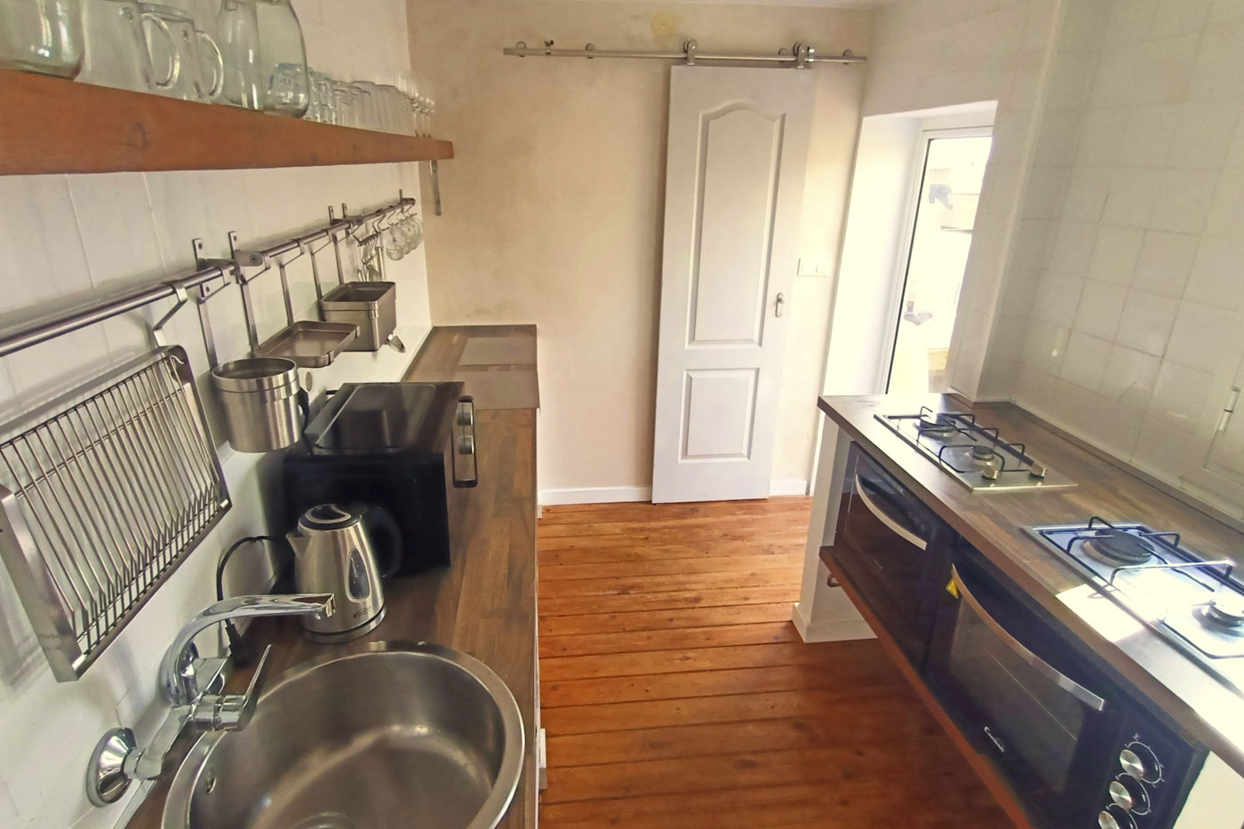 Kitchen with door to bathroom and to patio/terraces